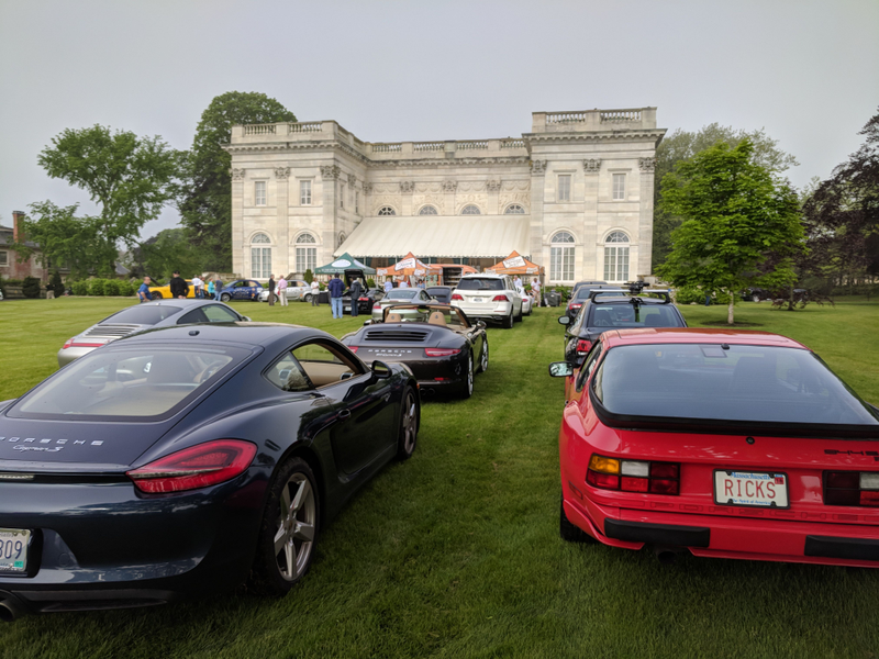 My car to the left, and a couple other surrounding Porsches arrive early.
